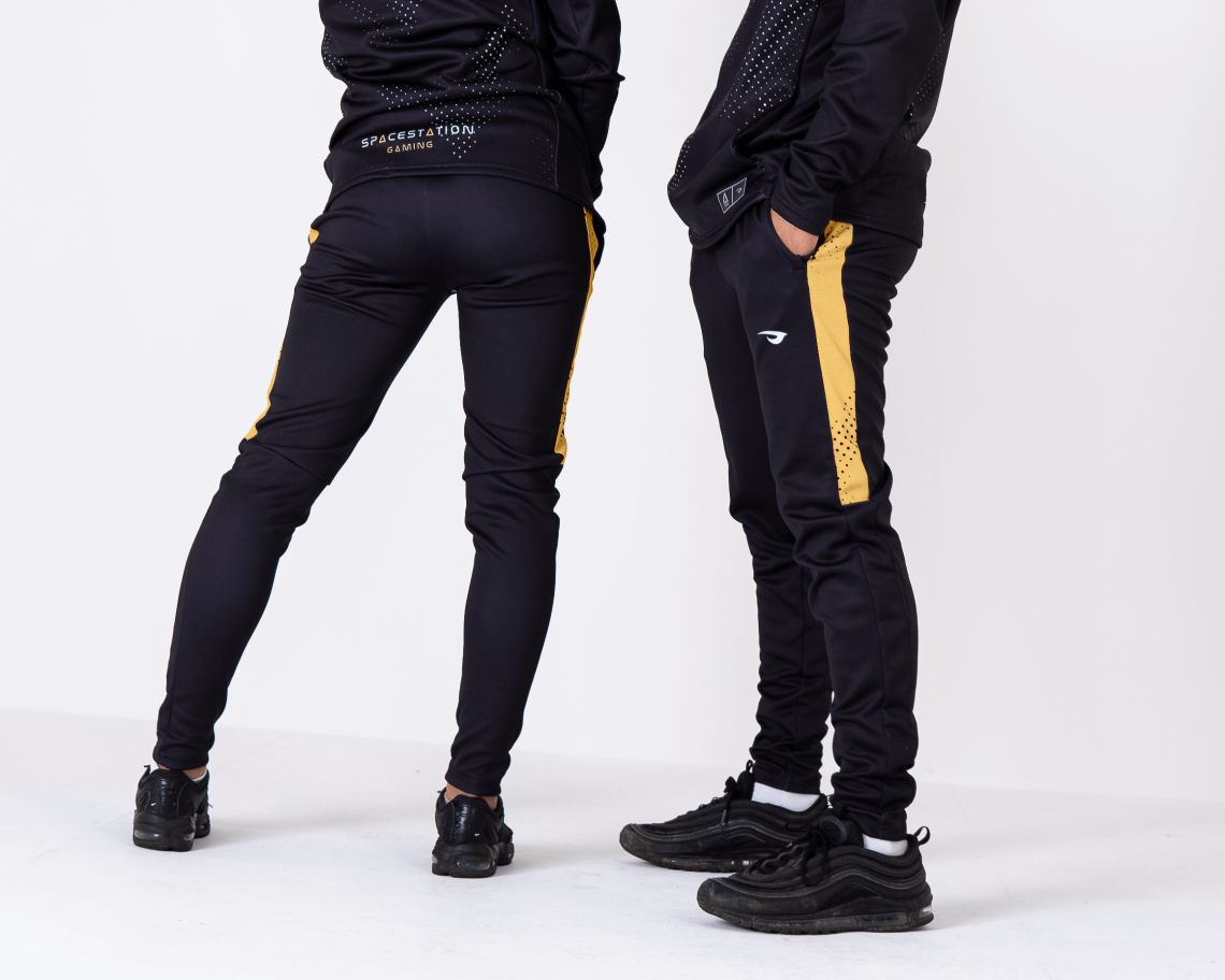 black joggers with gold zippers